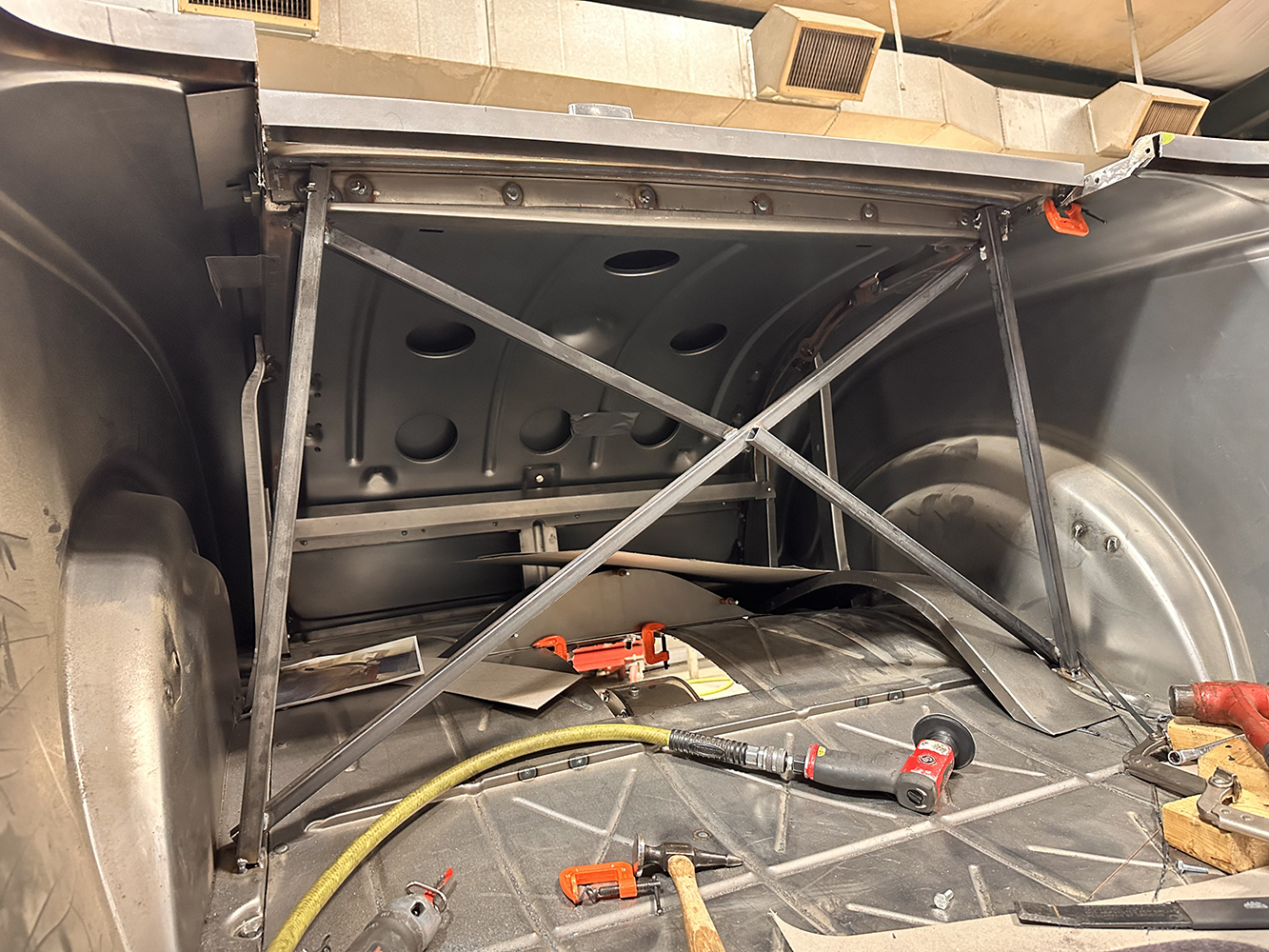 03 The rear chassis bracing of a 1932 Ford Roadster featuring crossbars and metal reinforcements for rigidity