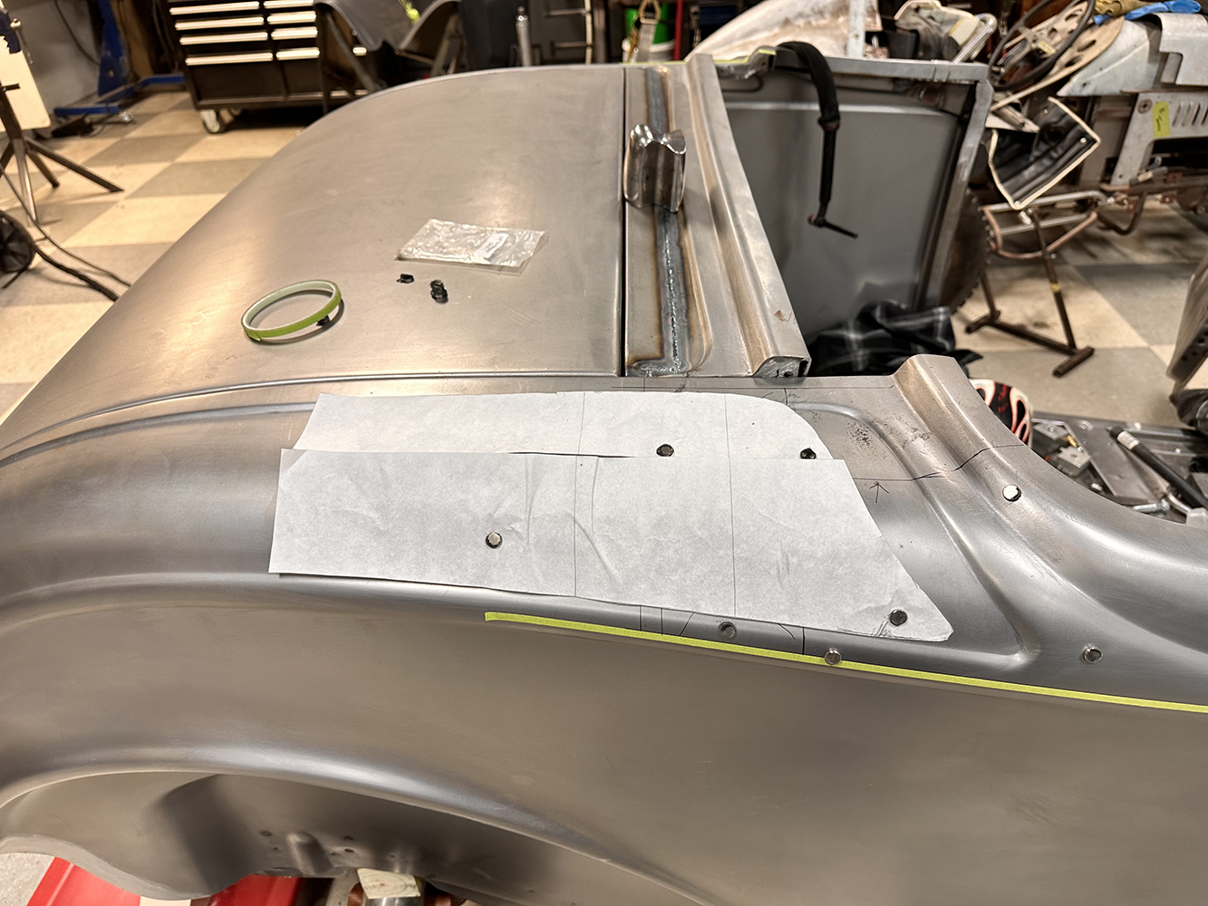 06 A template set on the rear quarter panel of a 1932 Ford Roadster marking custom body modifications