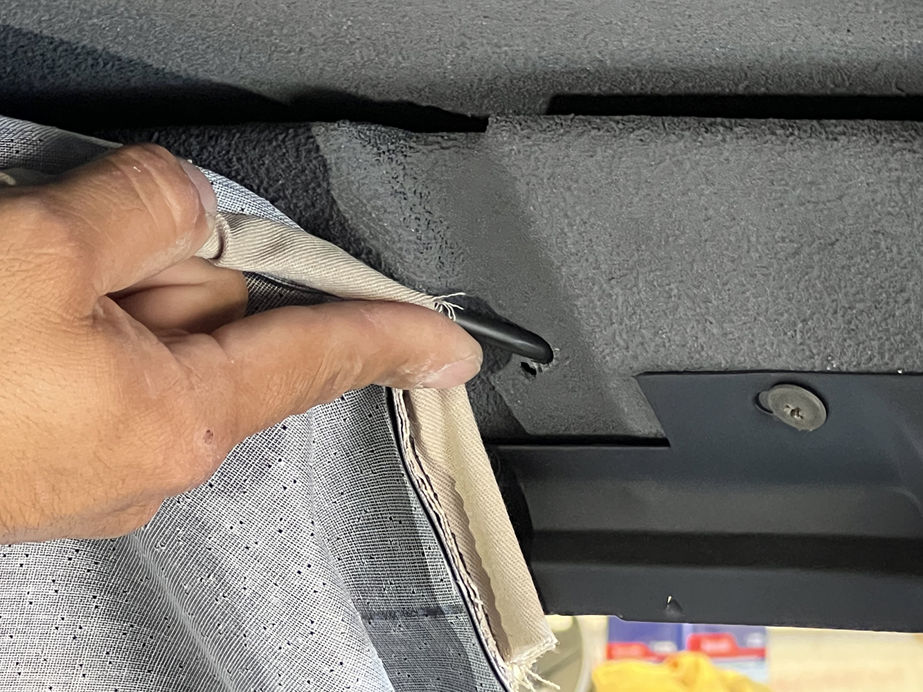06 Securing the headliner bow into the roof frame of a 1970 Chevy Nova