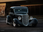 07 1933 Ford Five Window Coupe in golden hour lighting accentuating its curves and polished details