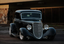07 1933 Ford Five Window Coupe in golden hour lighting accentuating its curves and polished details