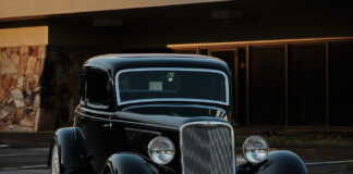07 1933 Ford Five Window Coupe in golden hour lighting accentuating its curves and polished details