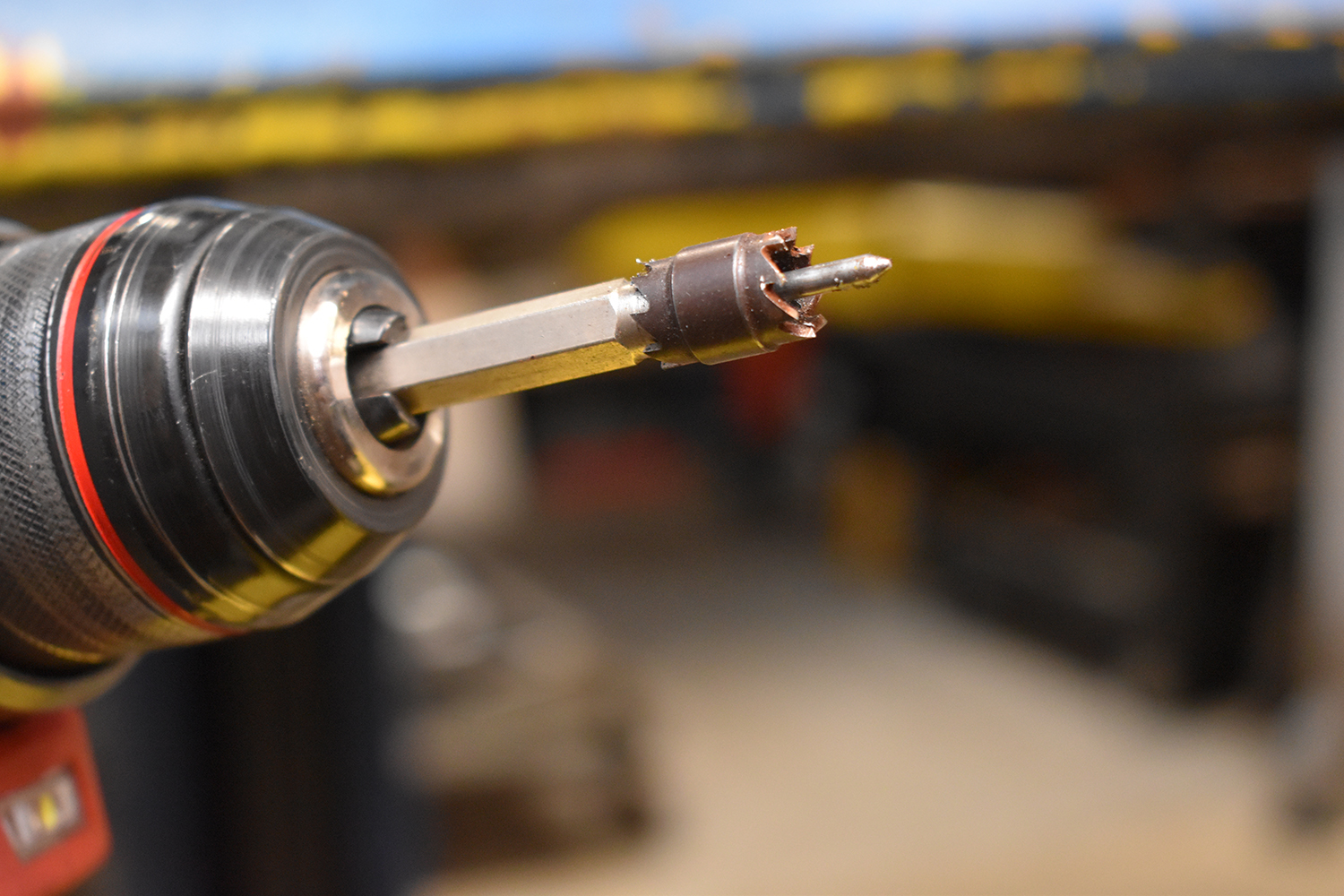 07 Hole saw bit attached to a drill for removing old spot welds