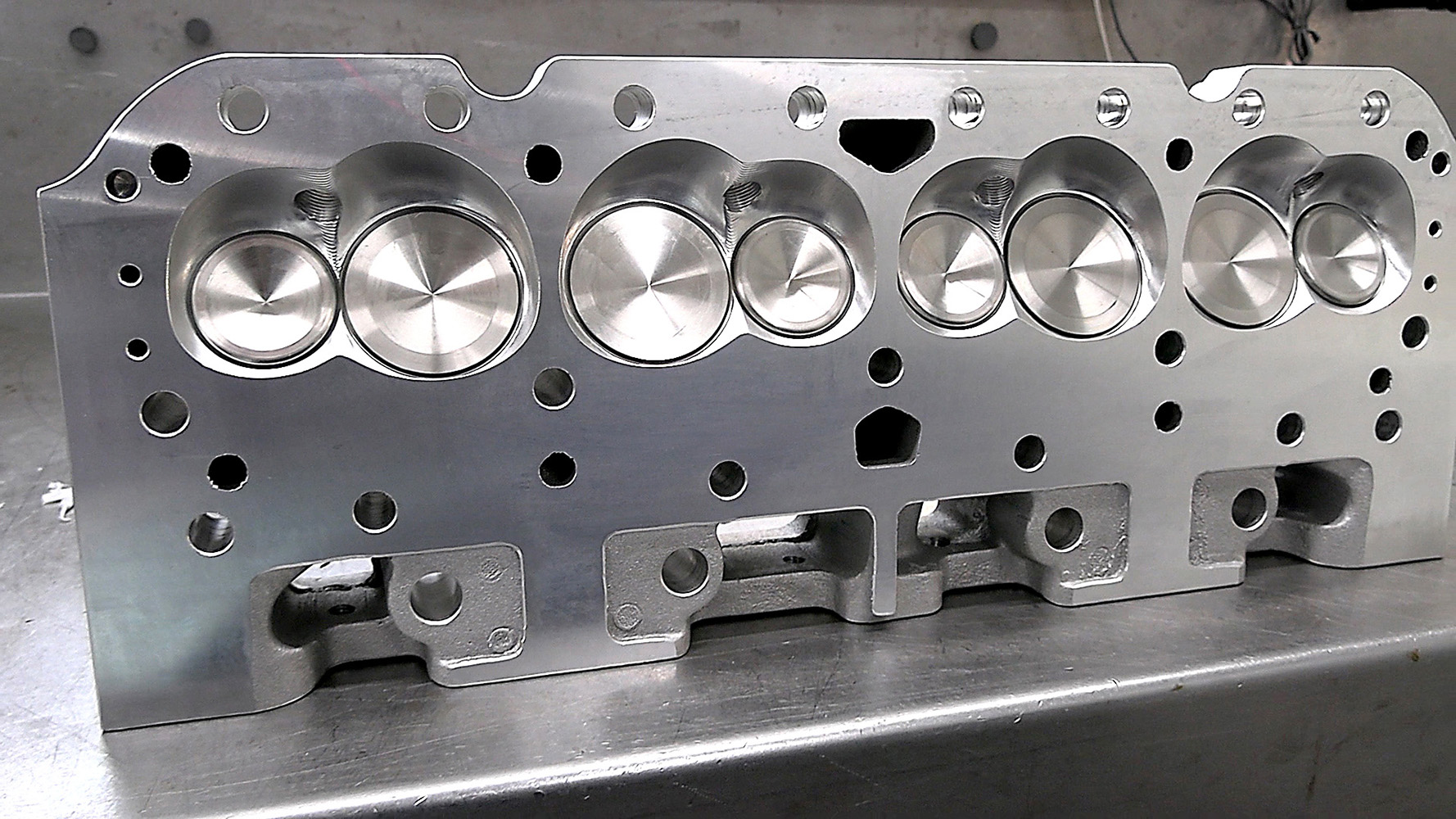 07 Machined aluminum cylinder head showing polished valve surfaces and port design