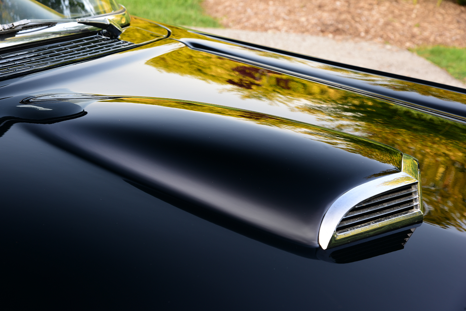 08 1957 Ford Custom hood featuring a factory style scoop and a deep mirror like black finish