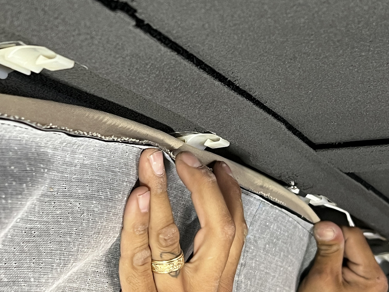 08 Clipping and securing the headliner edges for a proper fit in a 1970 Chevy Nova