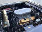 09 1957 Ford Custom engine bay with a Mercury valve covered V8 finned air cleaner and vintage performance parts