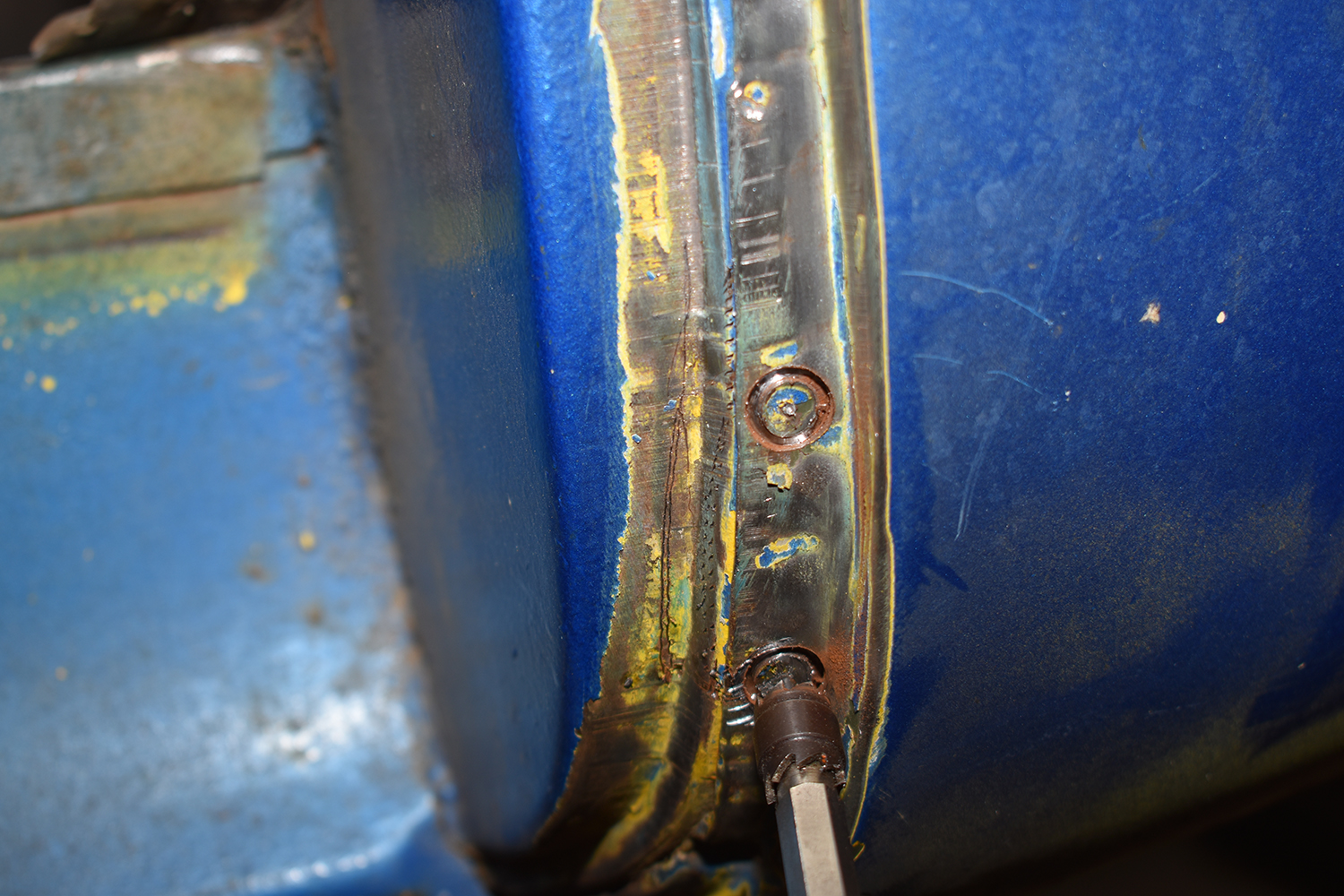 09 Close up of spot weld removal in progress on the cab corner