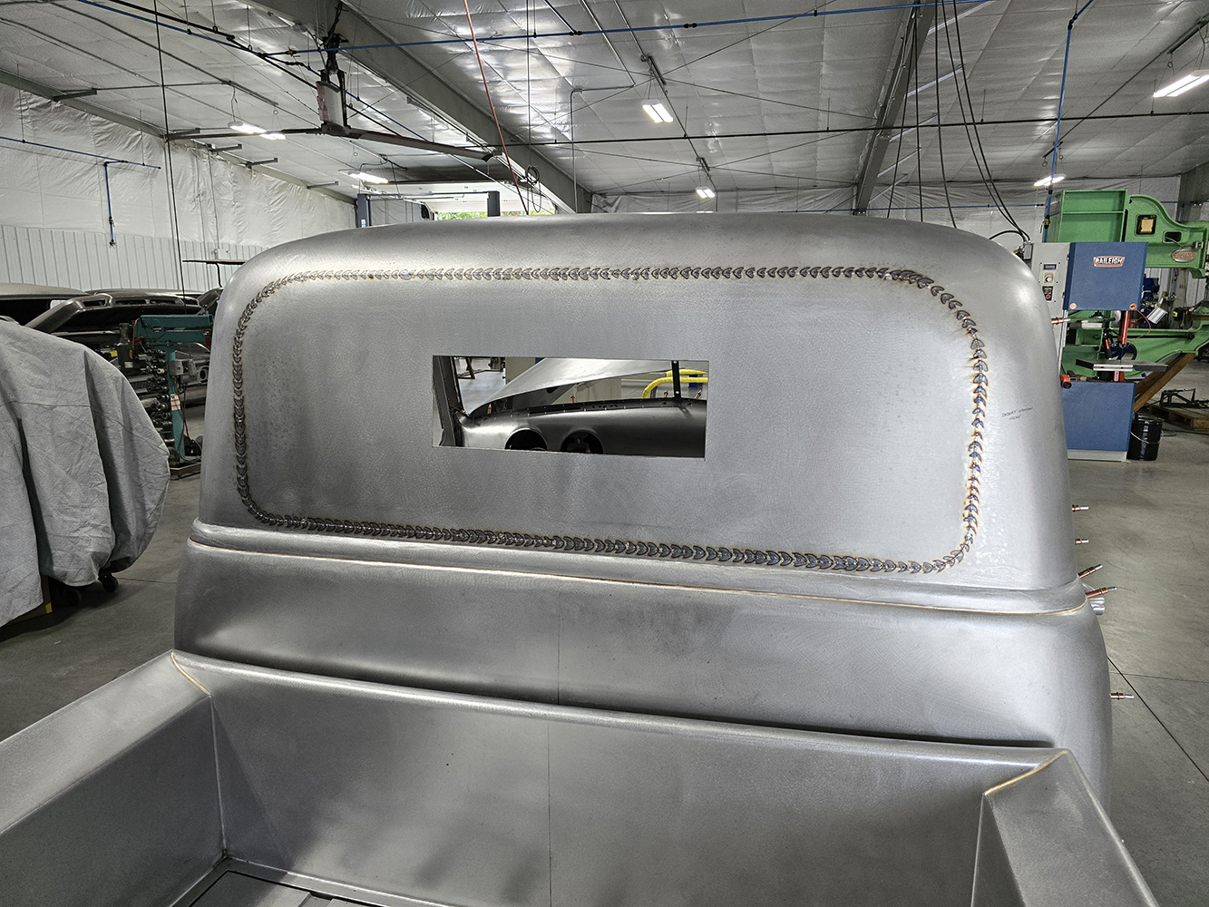 09 Freshly welded and smoothed rear cab panel with a unique window cutout
