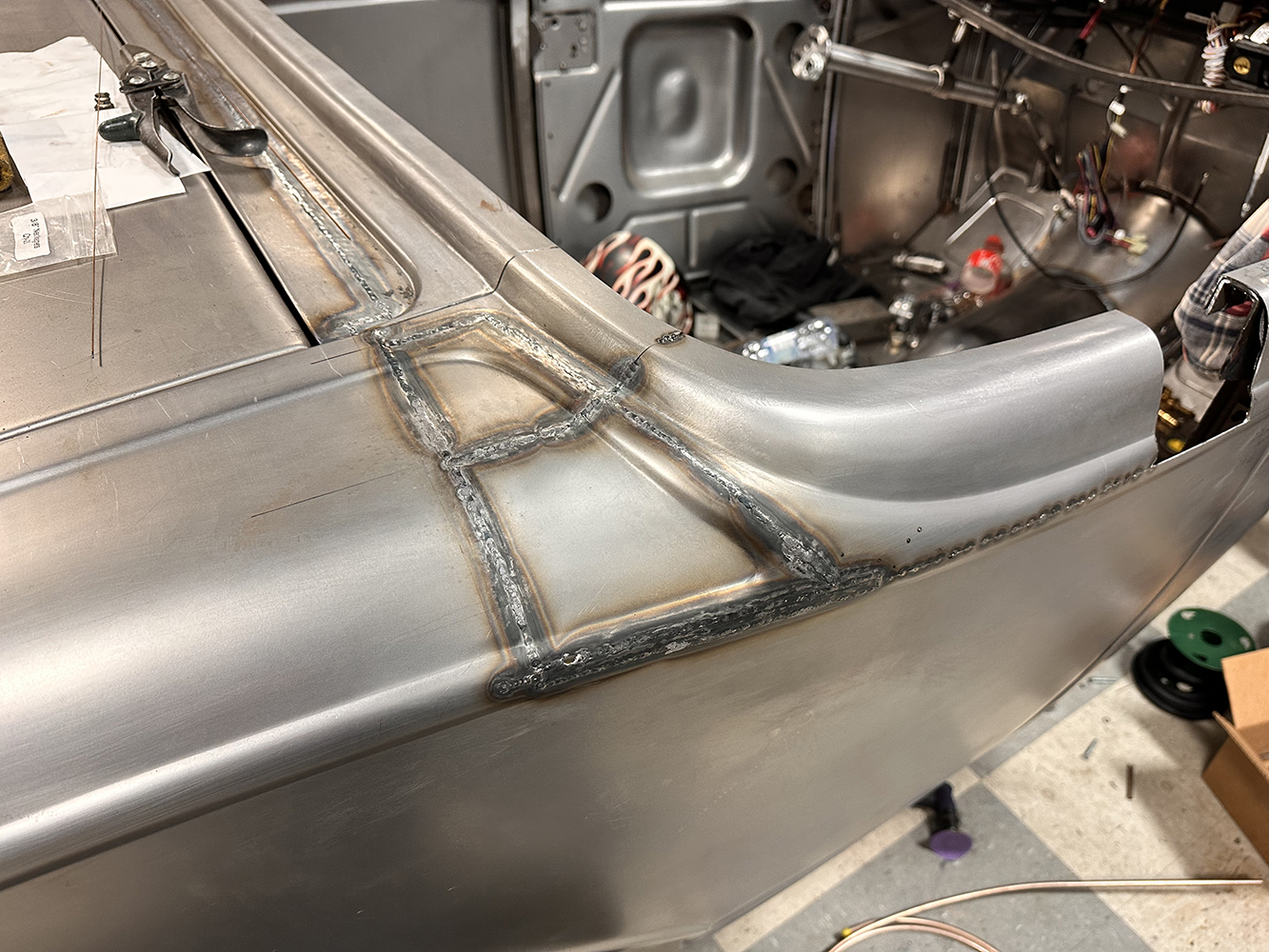 09 Metal finishing and structural reinforcement welded onto the rear section of a 1932 Ford Roadster