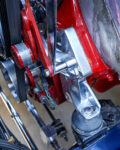 10 1932 Ford Tudor suspension and engine mount components with a mix of chrome and red accents