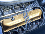 11 1957 Ford Custom engine with gold Mercury valve covers and vintage carburetor setup