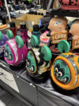 11 Custom Rat Fink Daruma – Hand painted Rat Fink inspired Daruma dolls and Mooneyes collectibles at a vendor booth