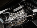 12 1933 Ford Five Window Coupe engine bay featuring a high performance Cobra powered V8 with polished valve covers
