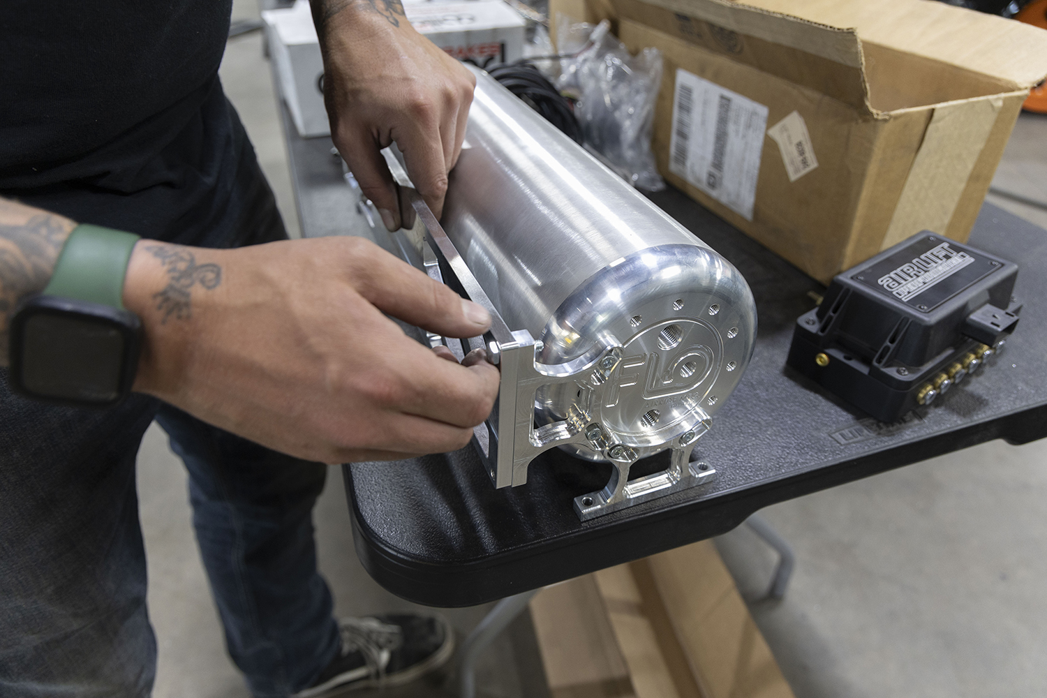 12 Custom mounting bracket being installed on the air tank