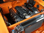 13 1957 Chevrolet Bel Air engine bay featuring an LS powerplant with polished components and a custom intake system