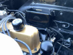 13 1957 Ford Custom engine bay with detailed black firewall and period correct wiring