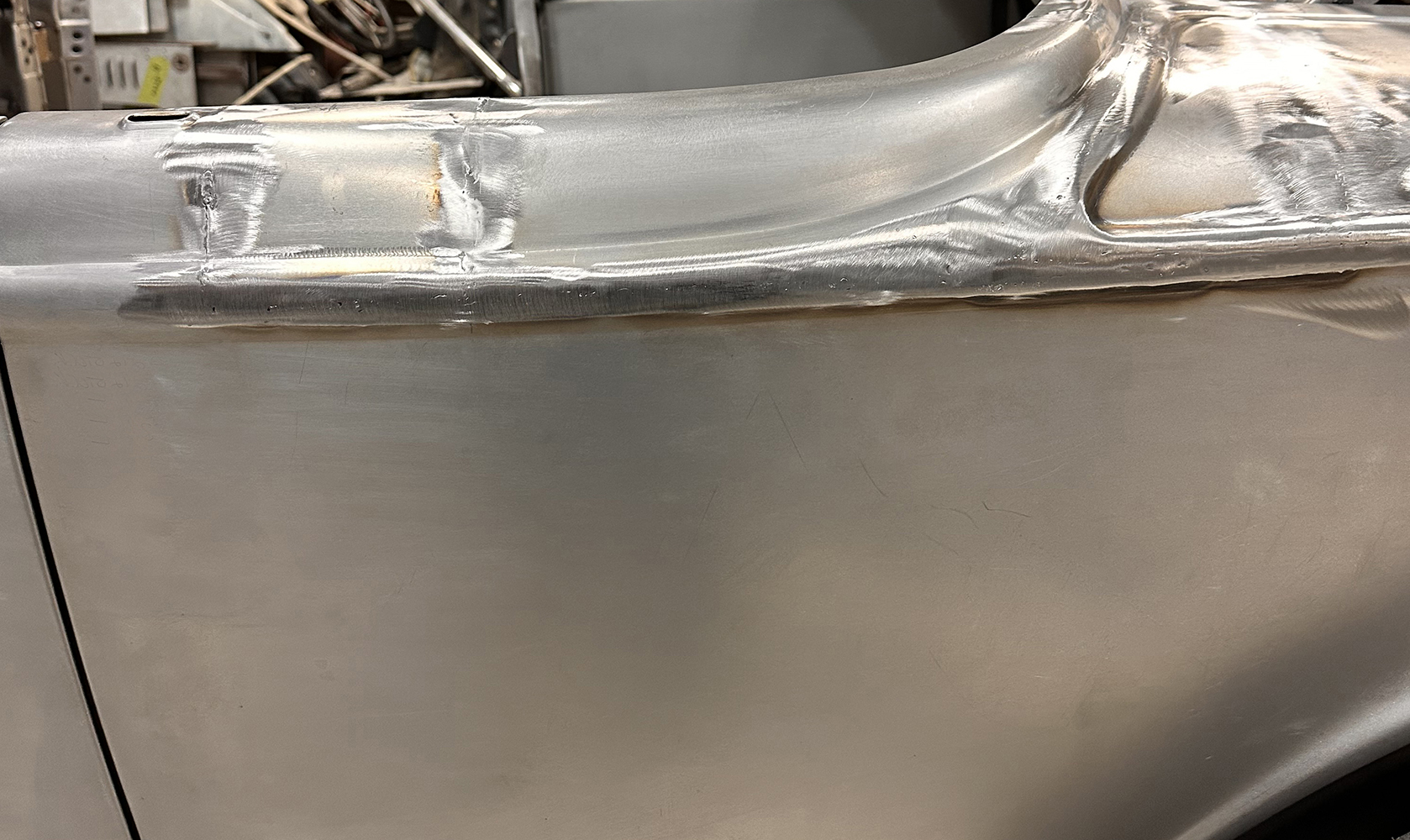 14 A 1932 Ford Roadster door seam with blended metalwork showcasing meticulous welding and finishing