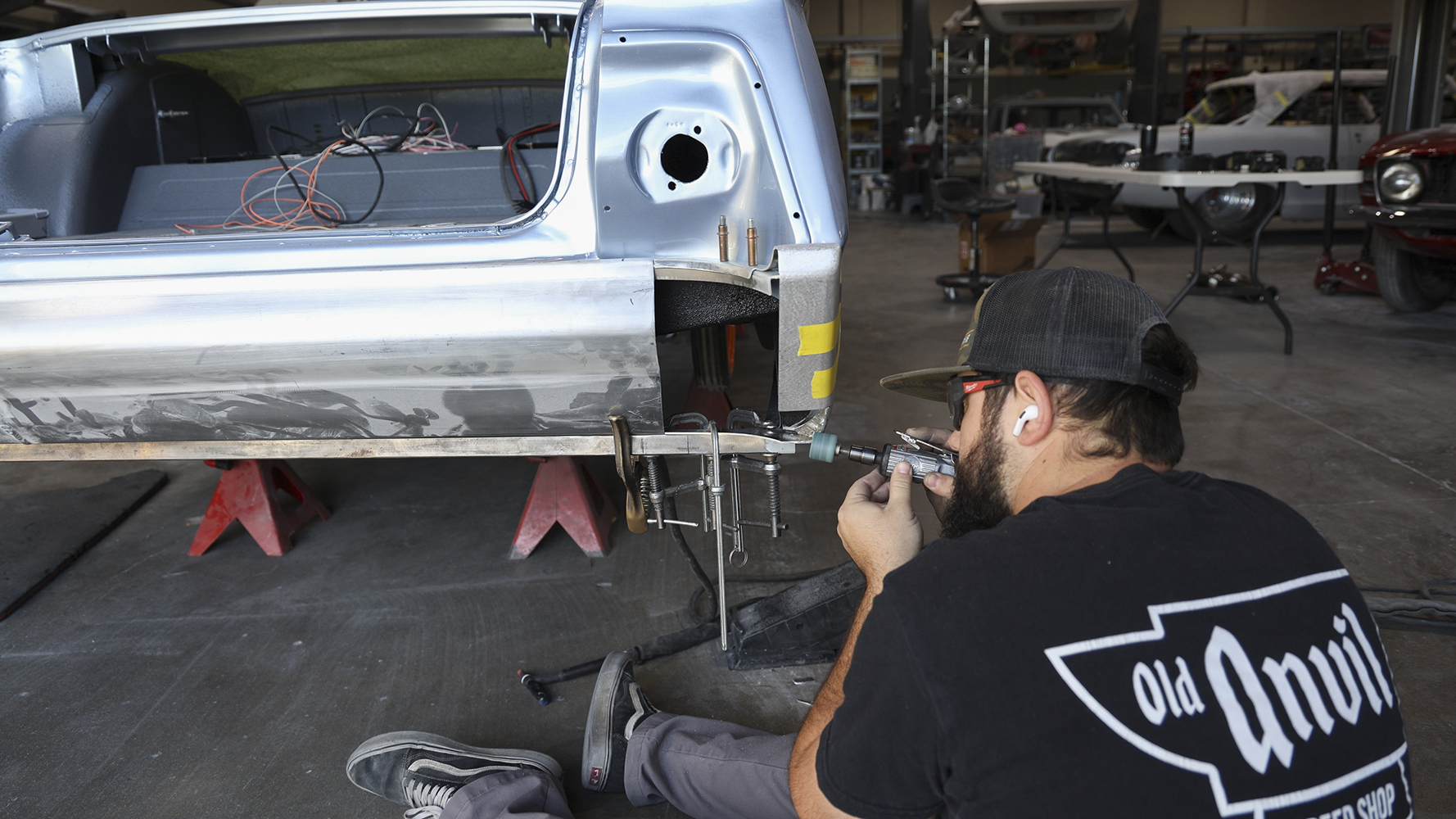 14 A fabricator working on rear quarter panel modifications for a 1962 Chevy Impala