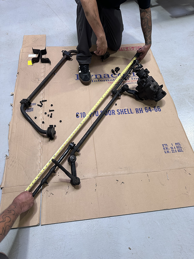 14 Measuring and comparing the old steering linkage to ensure proper fitment