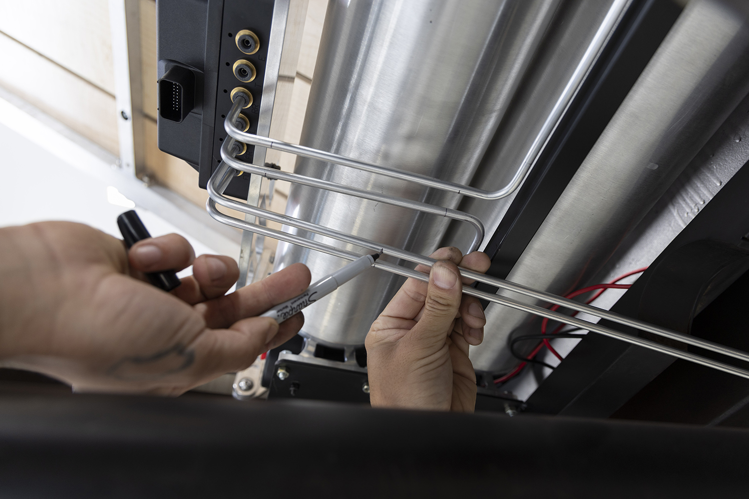 14 Stainless steel air lines being precision bent for installation
