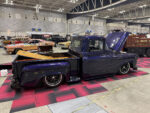 15 1955 Chevrolet 3100 – Deep blue with ghost flames and a wood bed sitting low