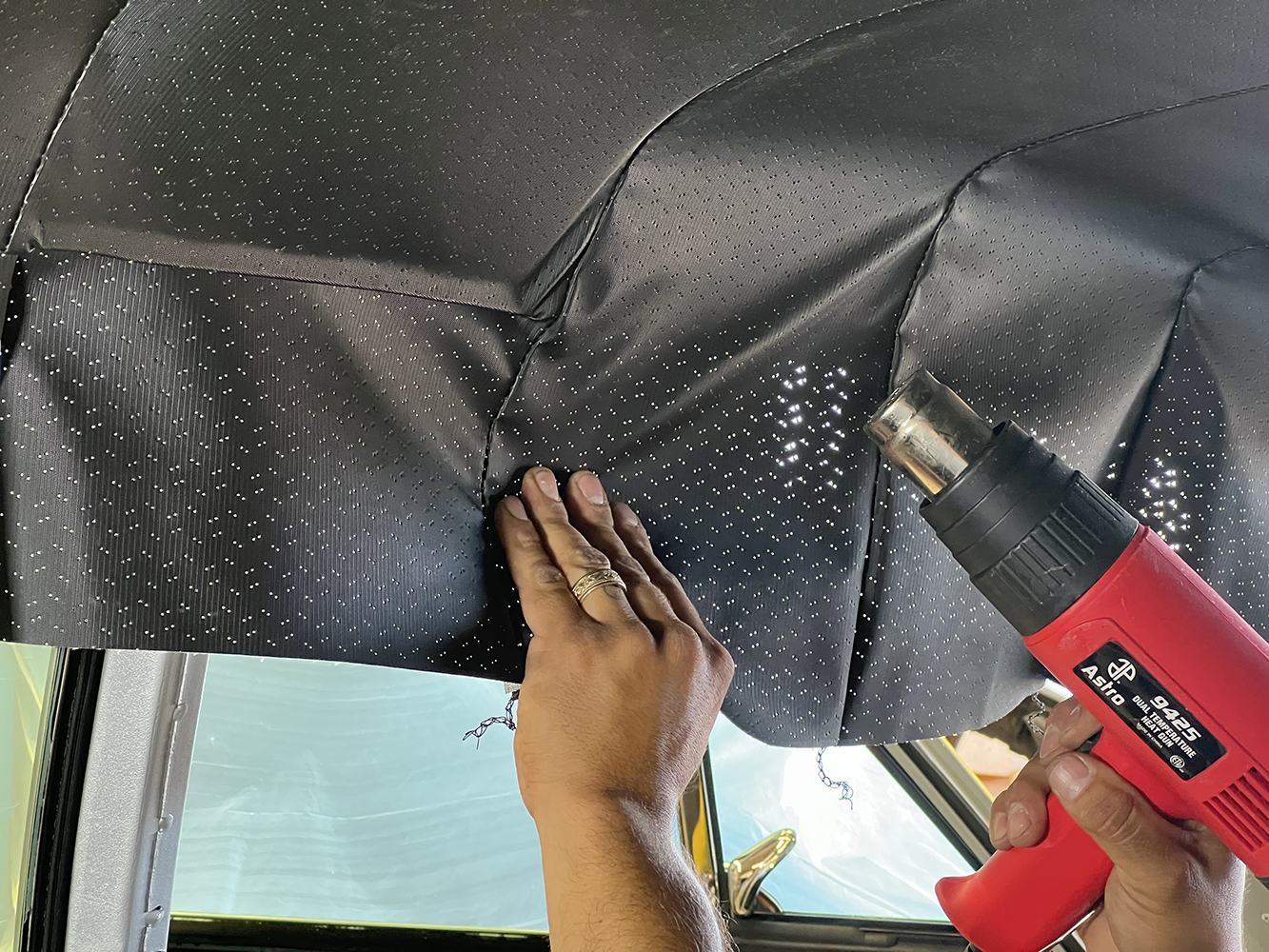 15 Using a heat gun to smooth out wrinkles in the 1970 Chevy Nova headliner