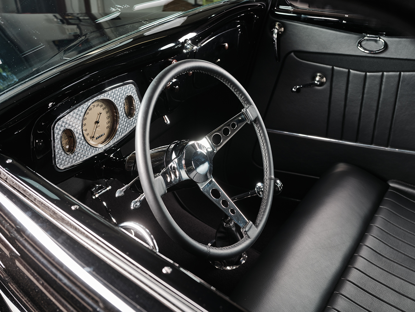 16 1933 Ford Five Window Coupe dashboard featuring a turned aluminum gauge panel and classic instrumentation