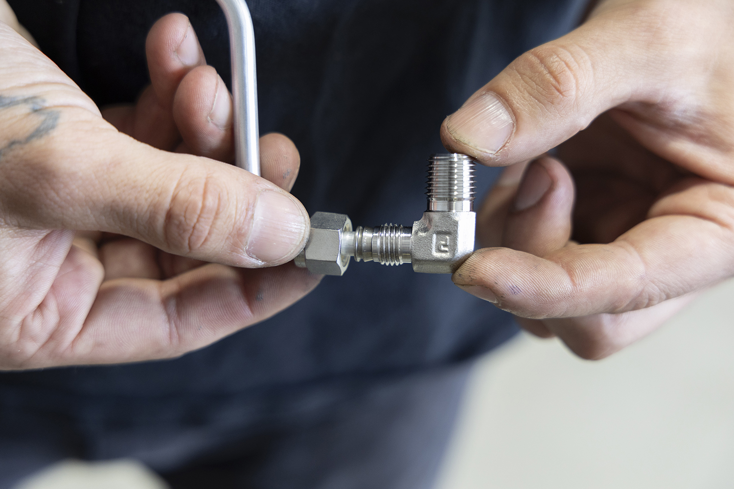 16 Precision machined air fittings being installed for leak free connections