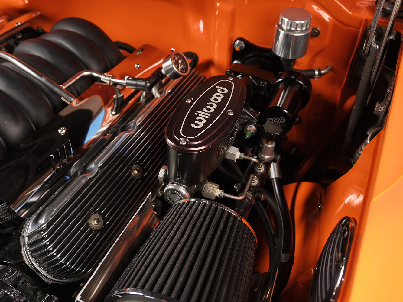 17 1957 Chevrolet Bel Air Wilwood brake booster and polished valve covers in a pristine engine bay