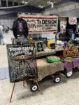 17 Pinstriping booth – T’s Design showcasing hand painted pinstriping and custom artwork