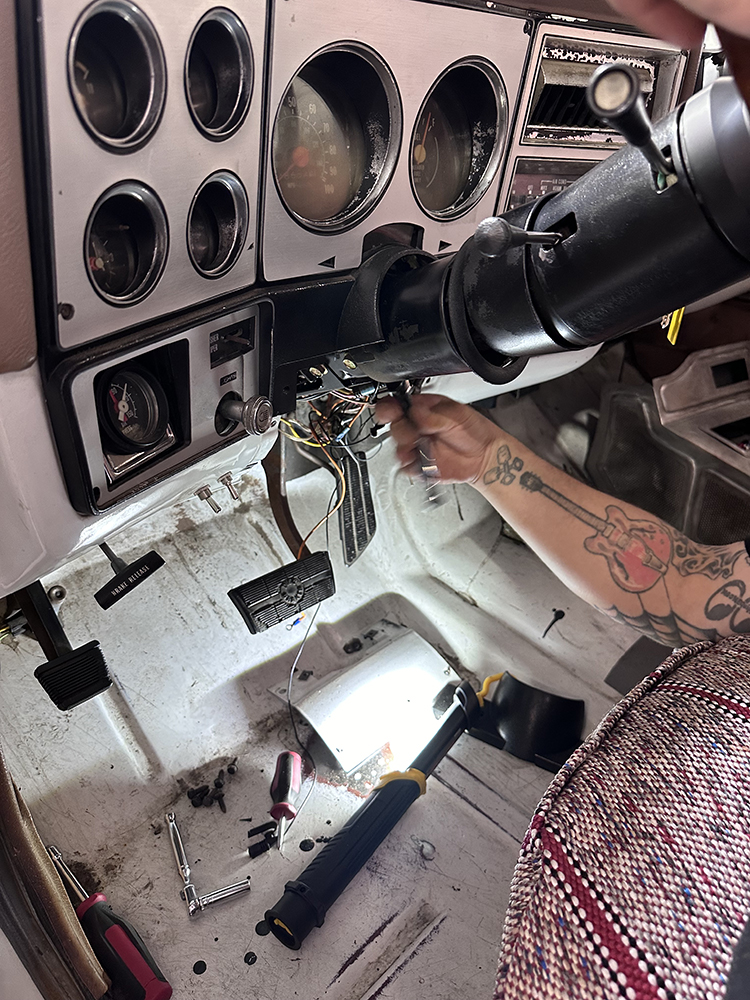 18 Wiring connections being adjusted under the dash for the new steering column installation