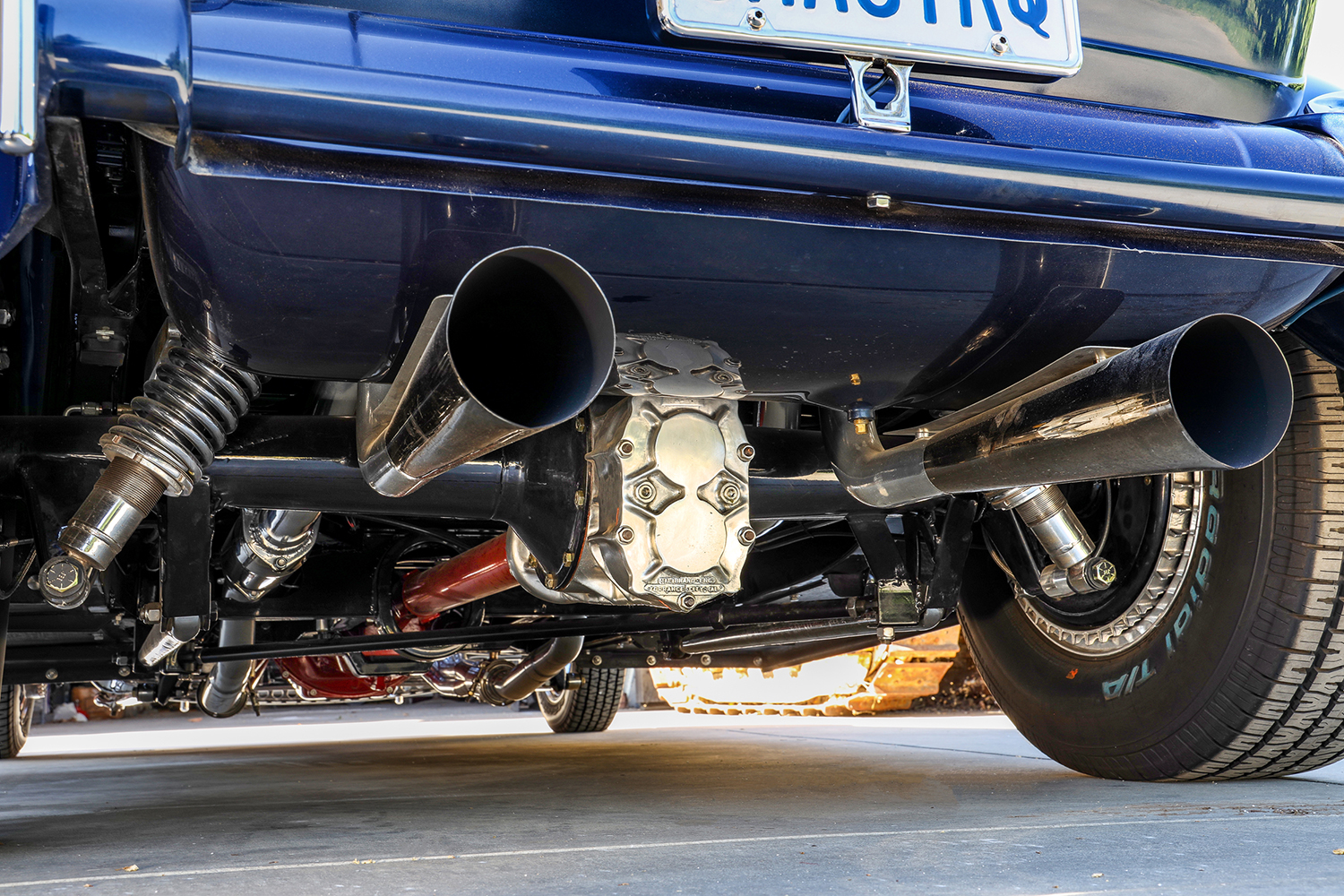 19 1932 Ford Tudor rear end showing polished exhaust tips and quick change differential