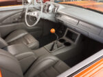 19 1957 Chevrolet Bel Air custom interior featuring modern bucket seats a sleek dashboard and a Hurst shifter