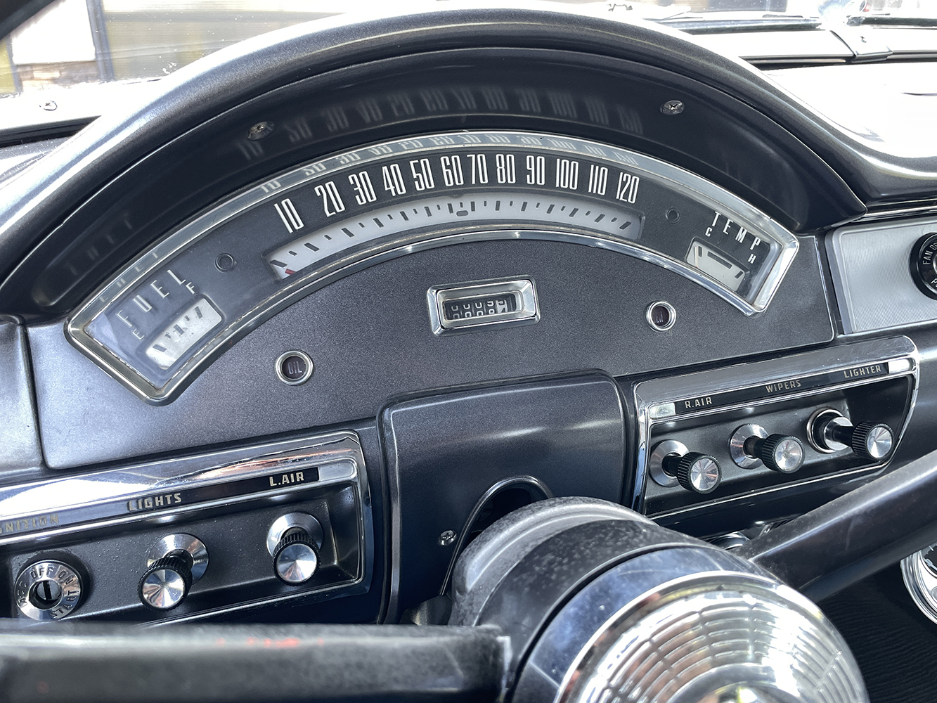 19 1957 Ford Custom dash with a sweeping speedometer fuel and temperature gauges and classic chrome switches
