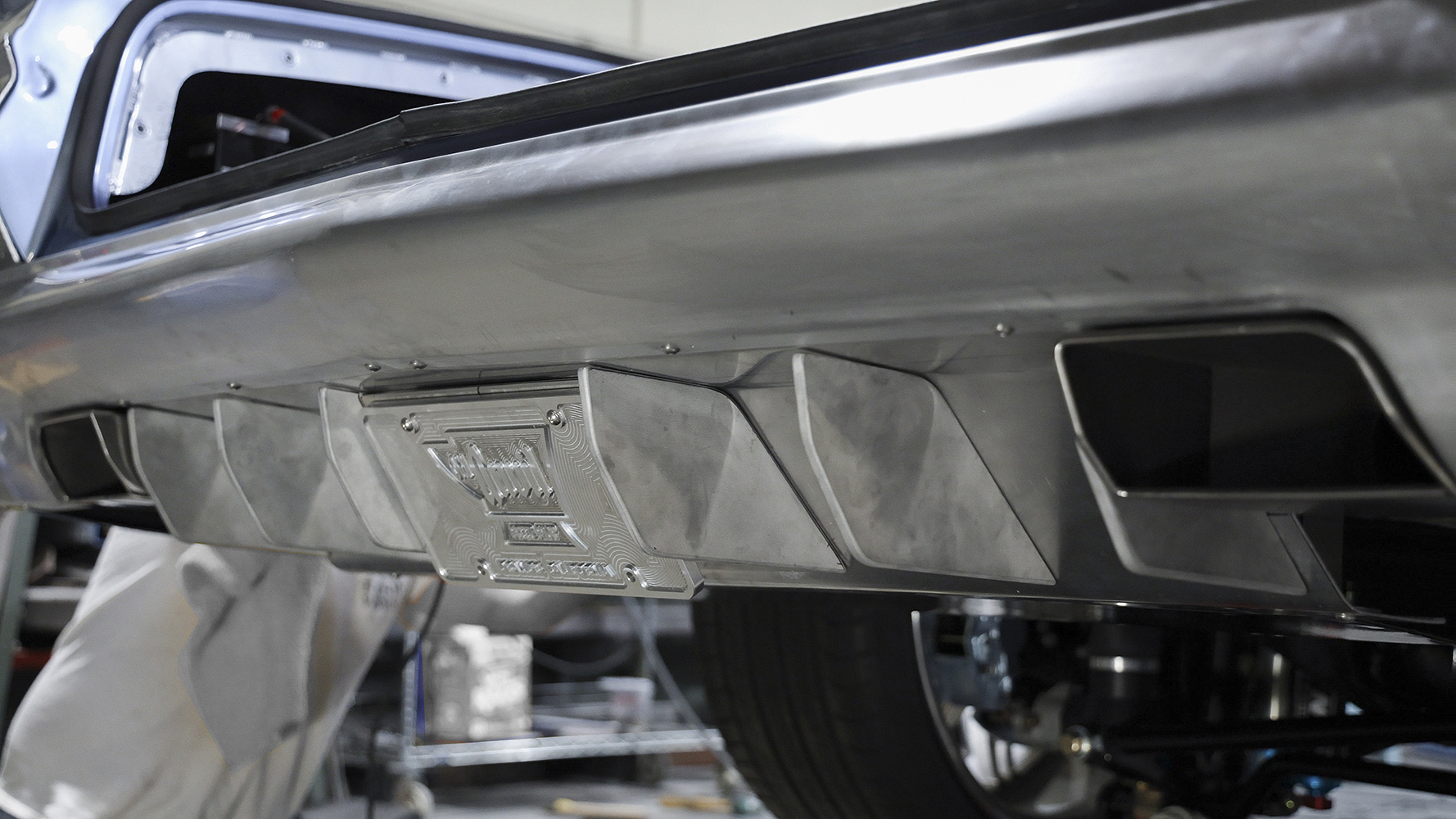 20 A completed custom aluminum rear diffuser installed on a 1962 Chevy Impala for a modernized look