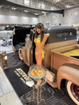 20 Custom built hot rod truck – Matte brown with a vintage aesthetic featuring a model posing beside it