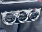 21 1957 Ford Custom Sunpro triple gauge cluster showing volts oil pressure and temperature
