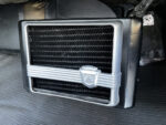 22 1957 Ford Custom under dash heater with a vintage grille and classic emblem