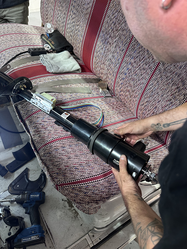 22 Preparing the new black steering column for installation