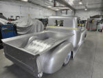 22 Rear three quarter view showing a custom bed and cab modifications