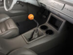 23 1957 Chevrolet Bel Air custom console with cup holders a Triolo’s Hot Rods shifter and modernized dash components