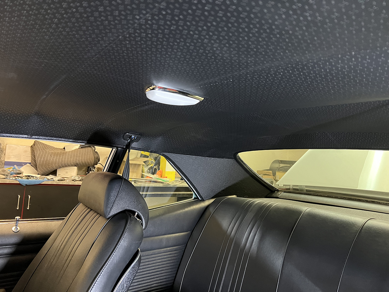24 Fully installed headliner with a factory style dome light inside a 1970 Chevy Nova