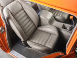 26 1957 Chevrolet Bel Air custom leather bucket seat with intricate stitching and modern ergonomic design