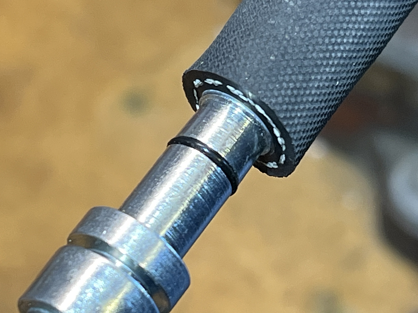 27 Close up of an AC hose pushed onto a barb fitting with an O ring for sealing