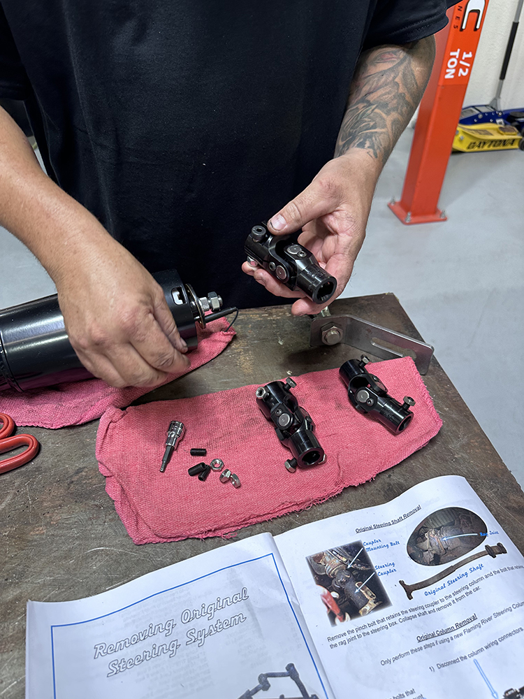 29 Assembling new U joints and steering shaft components for installation
