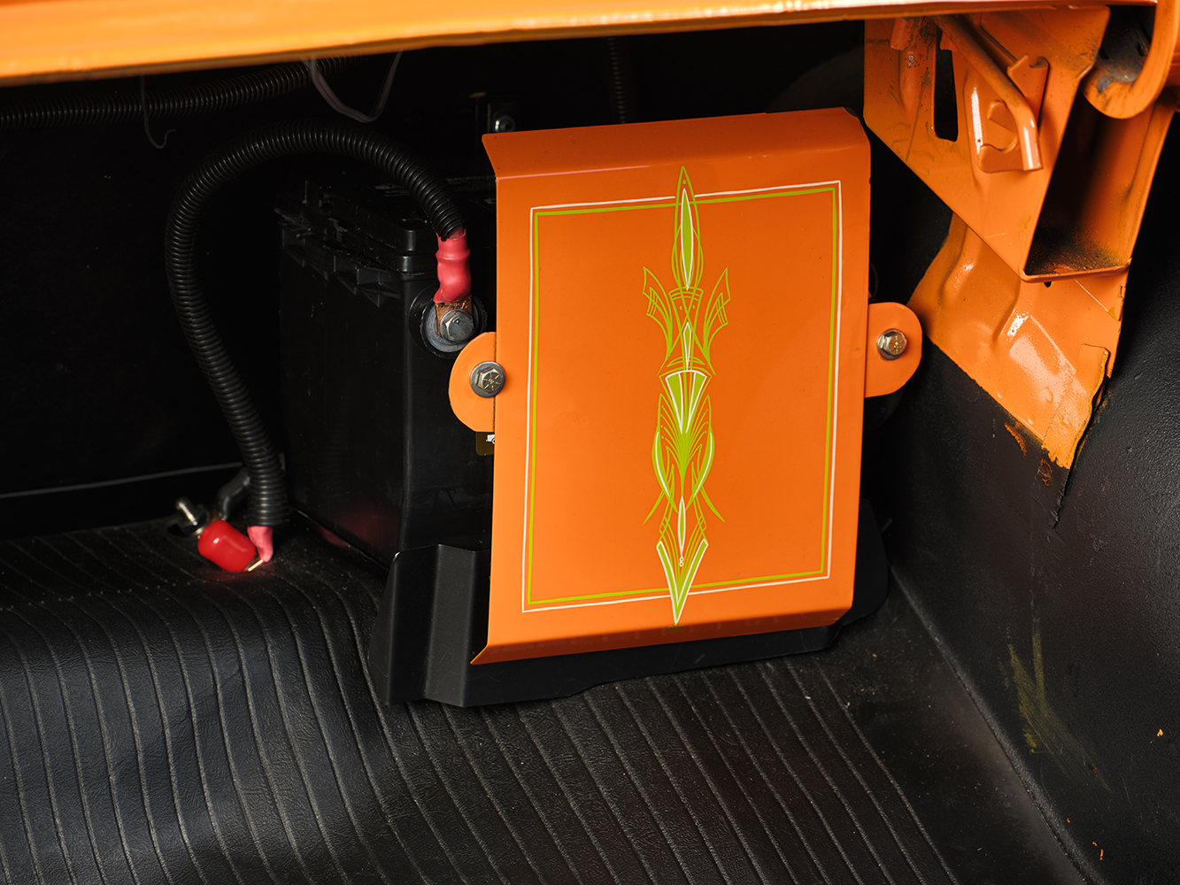 30 1957 Chevrolet Bel Air trunk with a custom pinstriped battery box and neatly wired electrical system