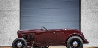 01 1932 Ford Roadster in deep burgundy featuring a minimalist highboy stance with black steel wheels and chrome hubcaps