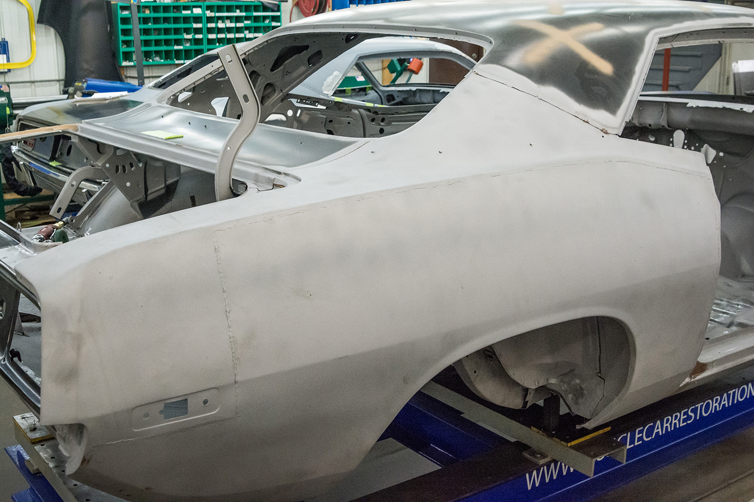 01 primer coated body panels showing the removed quarter panel and structural reinforcements
