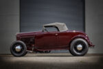02 1932 Ford Roadster with a traditional style black soft top enhancing its vintage hot rod look